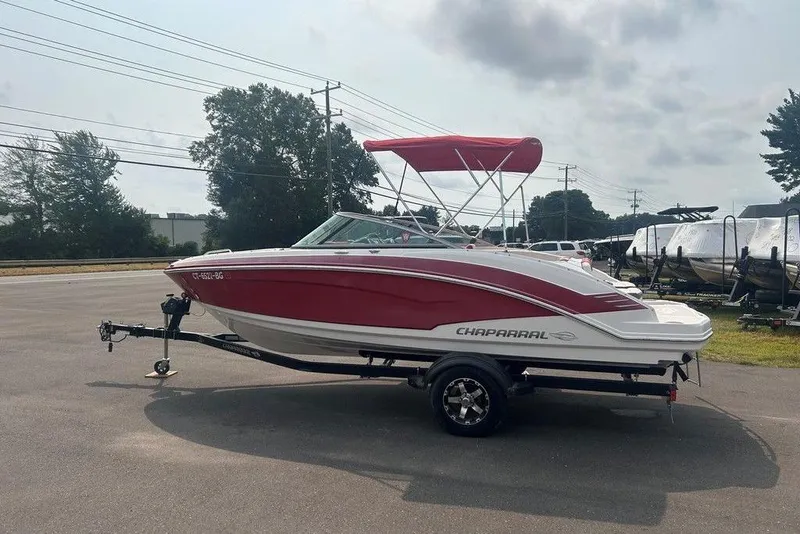 The Image of 2015 Chaparral Vortex 203 VR boat with red and white design on a trailer. - 1