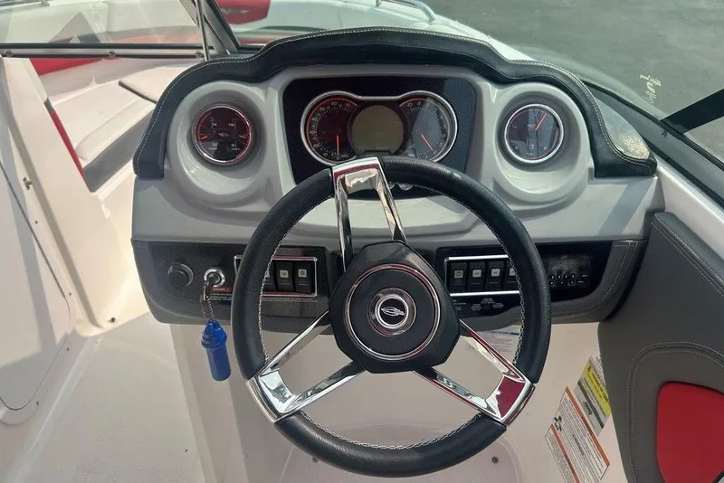 Slide: The Image of Steering wheel and dashboard of 2015 Chaparral Vortex 203 VR boat. - 13
