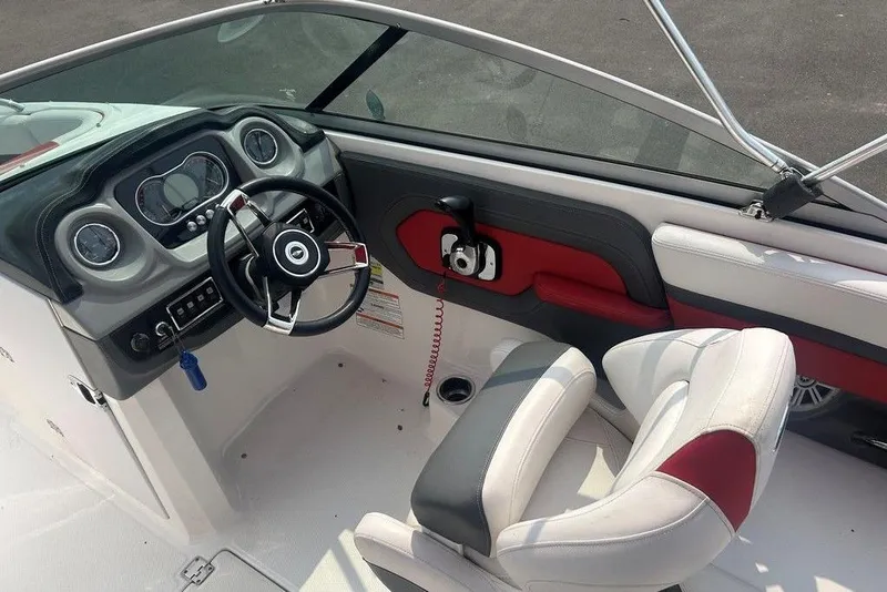 Slide: The Image of 2015 Chaparral Vortex 203 VR boat interior with steering wheel and dashboard. - 17