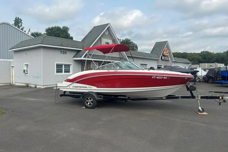 Slide: The Image of 2015 Chaparral Vortex 203 VR boat with red and white design on a trailer. - 4