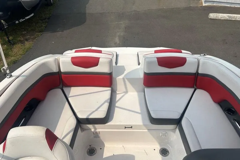 Slide: The Image of 2015 Chaparral Vortex 203 VR boat interior with red and white seating. - 8