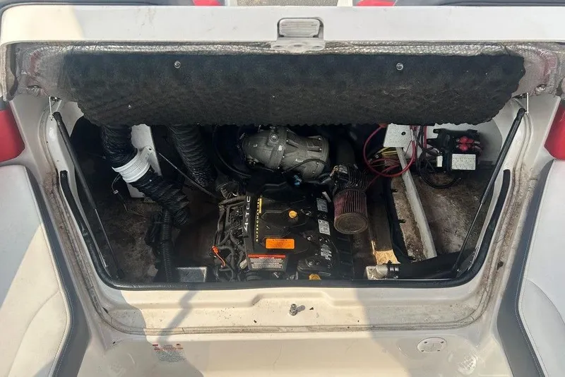 Slide: The Image of Engine compartment of a 2015 Chaparral Vortex 203 VR boat, showing mechanical components. - 9