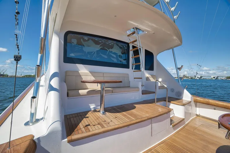 Slide: The Image of Luxurious 2010 Viking 82 Convertible yacht deck with seating and ocean view. - 15