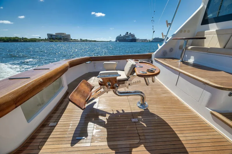 Slide: The Image of Luxurious 2010 Viking 82 Convertible yacht deck with fishing chair, cruising on sunny waters. - 17