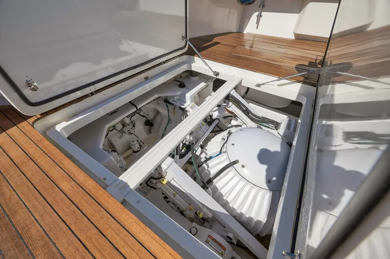 Slide: The Image of Engine compartment of 2010 Viking 82 Convertible yacht with wooden deck. - 19