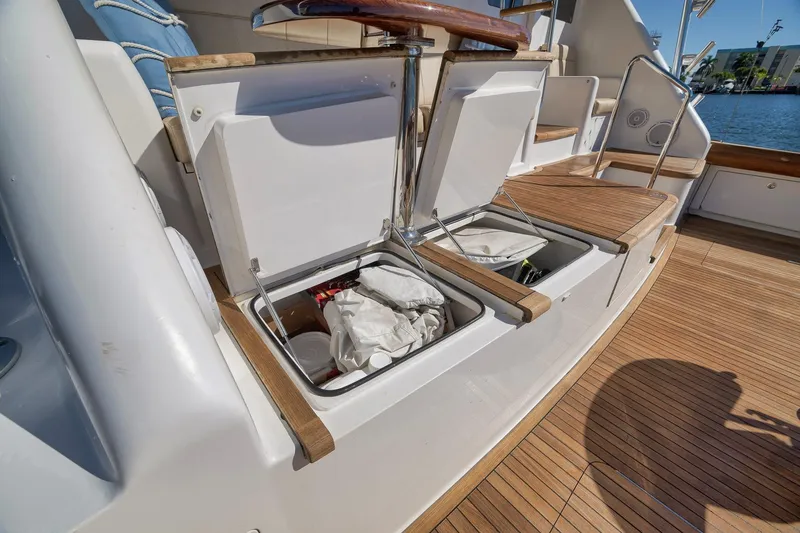 Slide: The Image of Open storage compartments on 2010 Viking 82 Convertible yacht deck, showcasing interior space. - 22