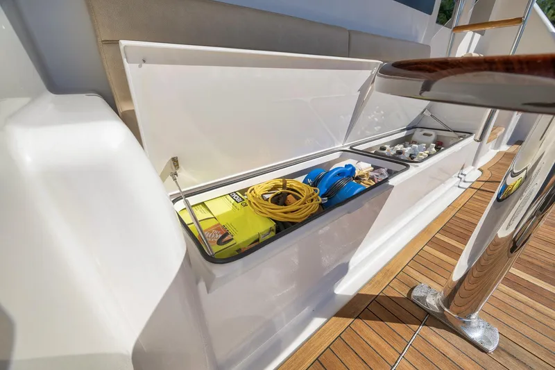 Slide: The Image of Storage compartment on 2010 Viking 82 Convertible yacht with cables and supplies. - 23