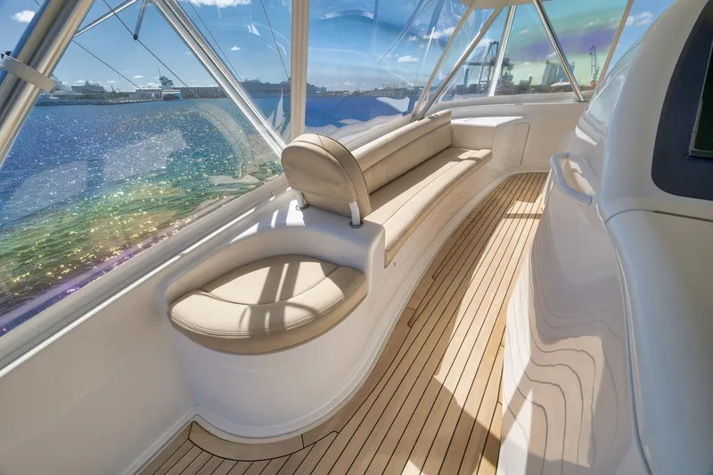 Slide: The Image of Luxurious interior of 2010 Viking 82 Convertible yacht with panoramic windows and elegant seating. - 31