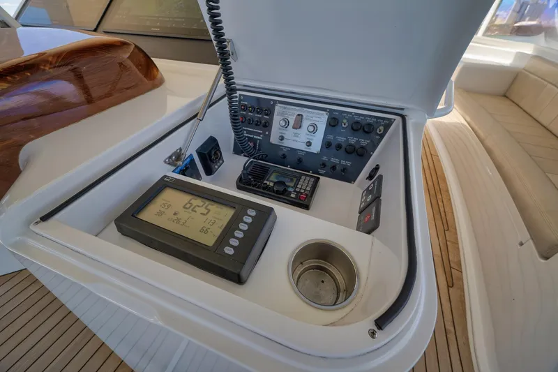 Slide: The Image of Control panel of 2010 Viking 82 Convertible yacht with navigation instruments and seating area. - 35