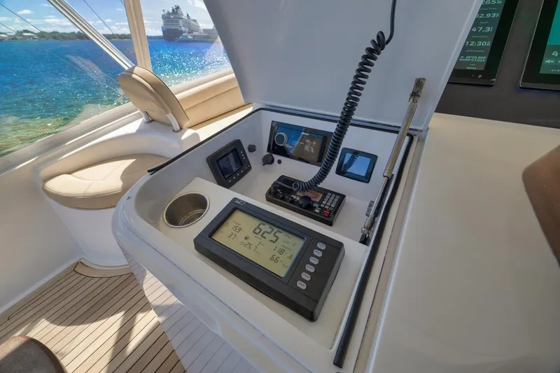 Slide: The Image of Control panel of a 2010 Viking 82 Convertible yacht with ocean view. - 36