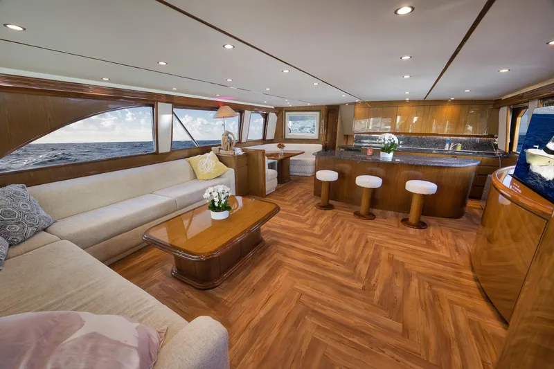 Slide: The Image of Luxurious interior of 2010 Viking 82 Convertible yacht with elegant wood finishes and plush seating. - 38