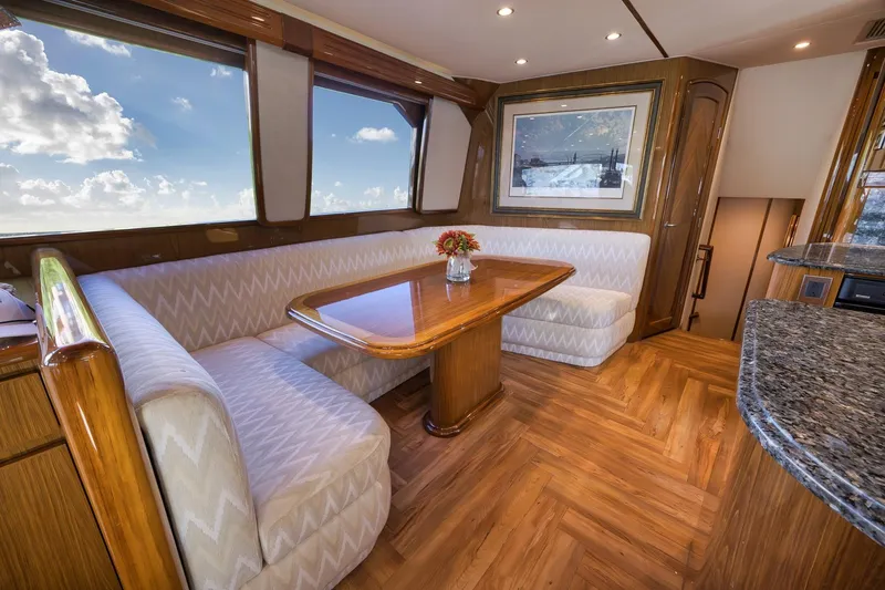 Slide: The Image of Luxurious interior of 2010 Viking 82 Convertible yacht with elegant dining area and scenic windows. - 41