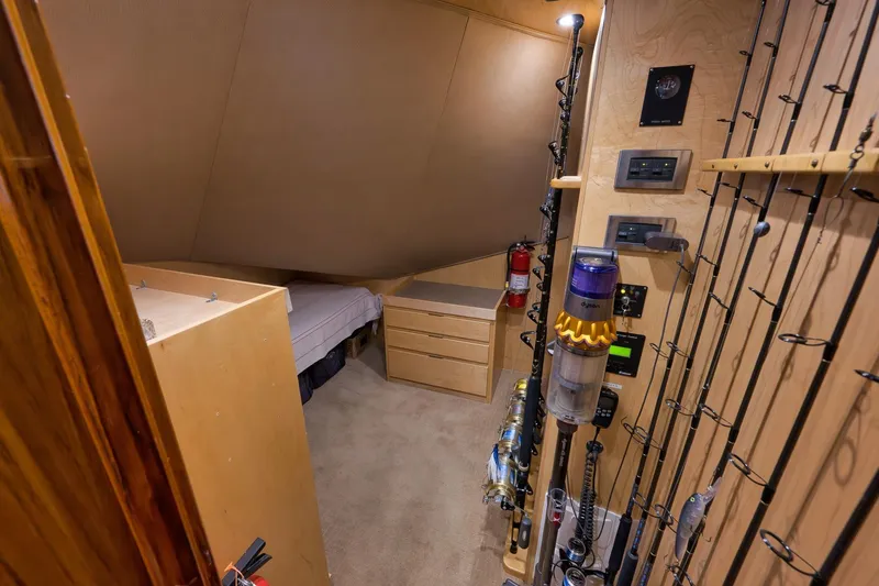 Slide: The Image of Interior of 2010 Viking 82 Convertible yacht with fishing rods and storage. - 49