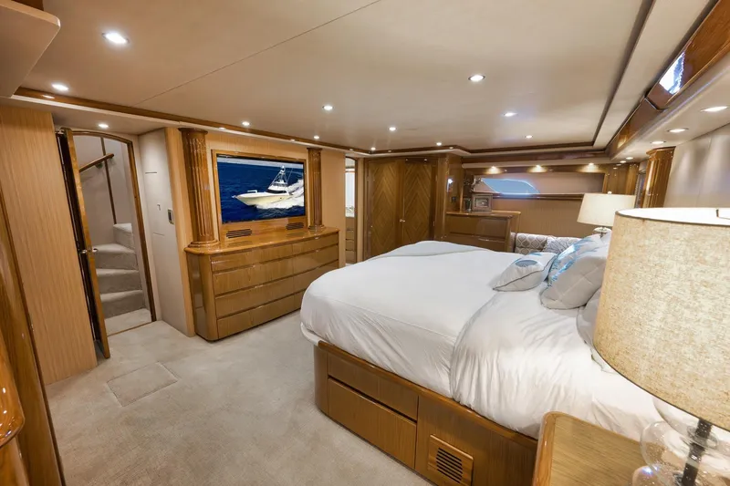 Slide: The Image of Luxurious bedroom interior of 2010 Viking 82 Convertible yacht with elegant wood finishes. - 55