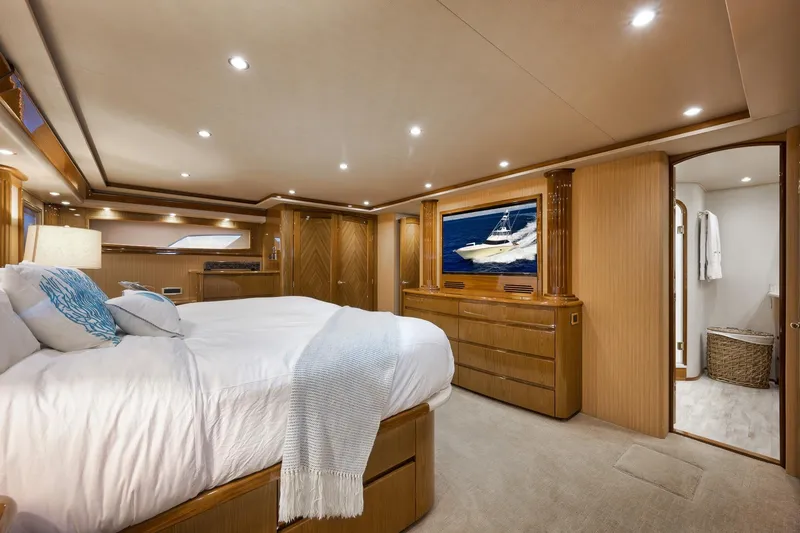 Slide: The Image of Luxurious bedroom interior of 2010 Viking 82 Convertible yacht with elegant wood finishes. - 56