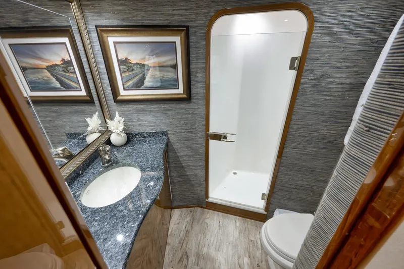 Slide: The Image of Luxurious bathroom in 2010 Viking 82 Convertible yacht with elegant decor and modern amenities. - 57