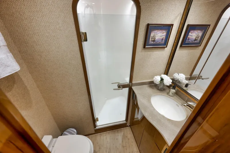 Slide: The Image of Luxurious bathroom in 2010 Viking 82 Convertible yacht with elegant decor and modern amenities. - 66