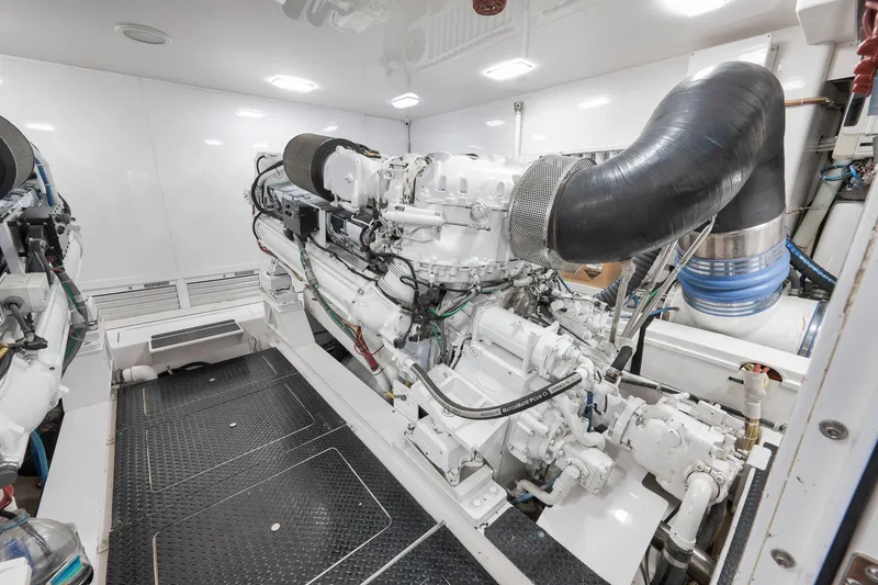 Slide: The Image of Engine room of 2010 Viking 82 Convertible yacht, showcasing powerful machinery and clean design. - 68