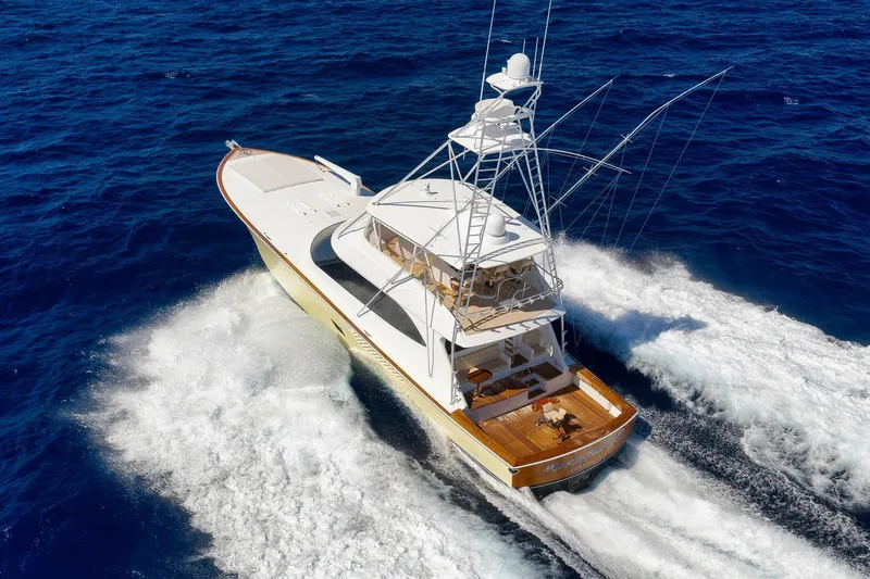 Slide: The Image of 2010 Viking 82 Convertible yacht cruising on open ocean waters. - 7