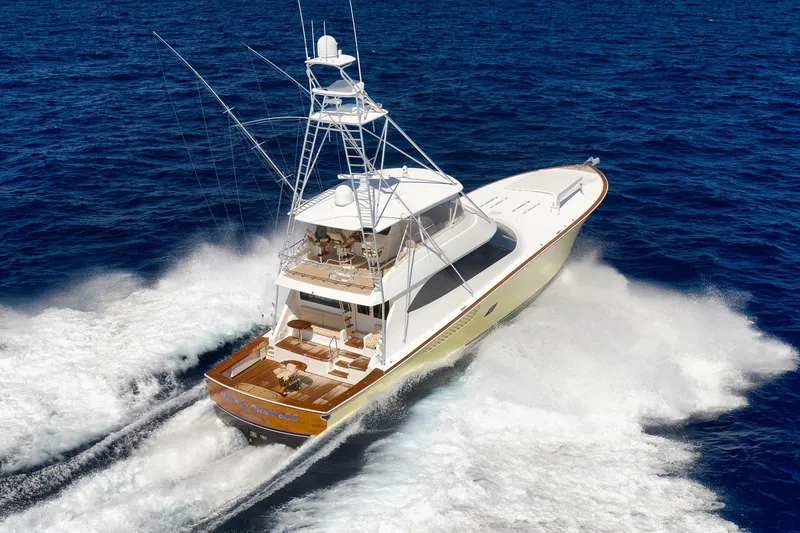 Slide: The Image of 2010 Viking 82 Convertible yacht cruising on open ocean waters. - 9