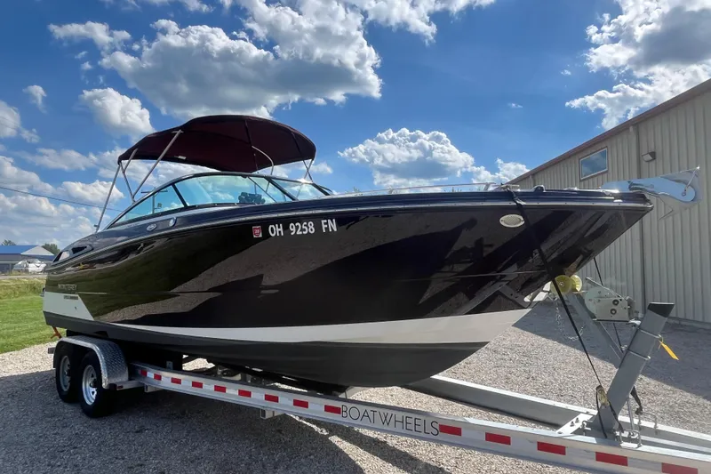The Image of 2015 Monterey 268 SSC boat on trailer under a clear blue sky. - 0