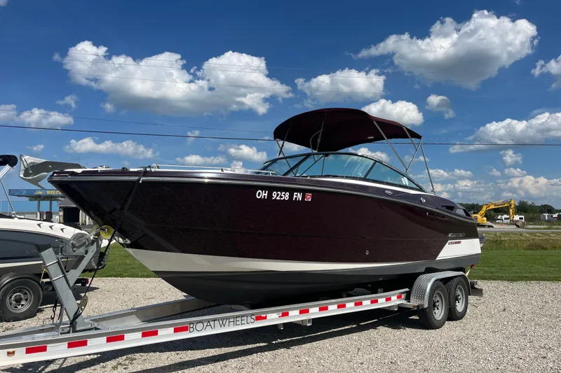 Slide: The Image of 2015 Monterey 268 SSC boat on trailer under blue sky with clouds. - 18