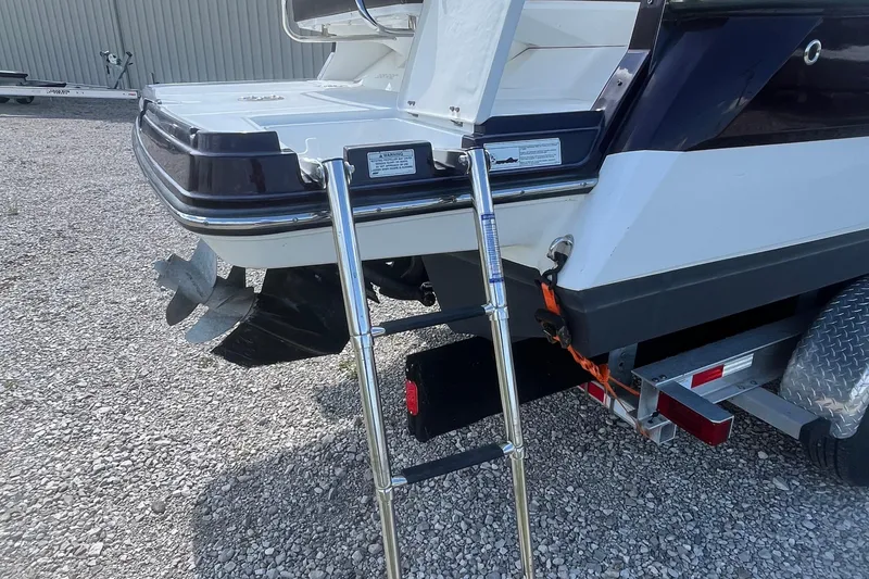 Slide: The Image of 2015 Monterey 268 SSC boat with ladder and propeller on a trailer. - 5