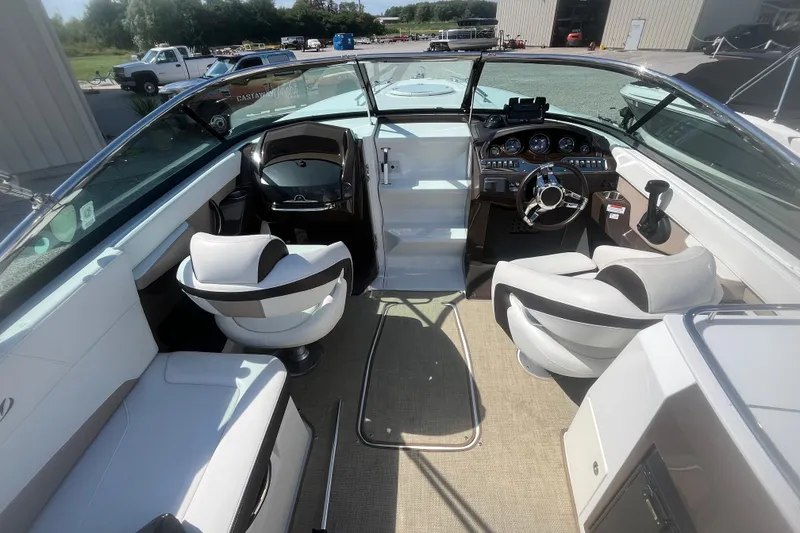 Slide: The Image of 2015 Monterey 268 SSC boat interior with modern dashboard and seating. - 6