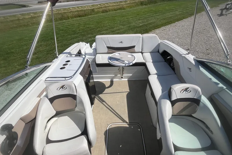 Slide: The Image of 2015 Monterey 268 SSC boat interior with plush seating and table, showcasing luxury design. - 7