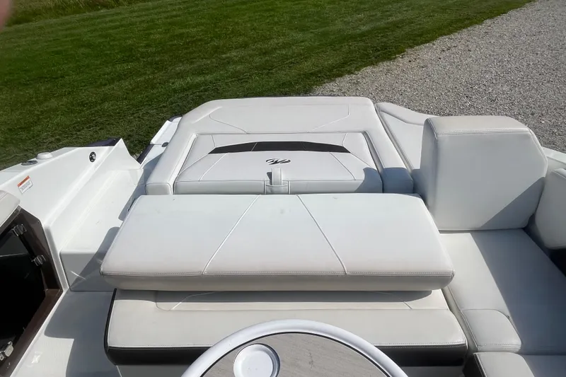 Slide: The Image of 2015 Monterey 268 SSC boat interior with white cushioned seating. - 8