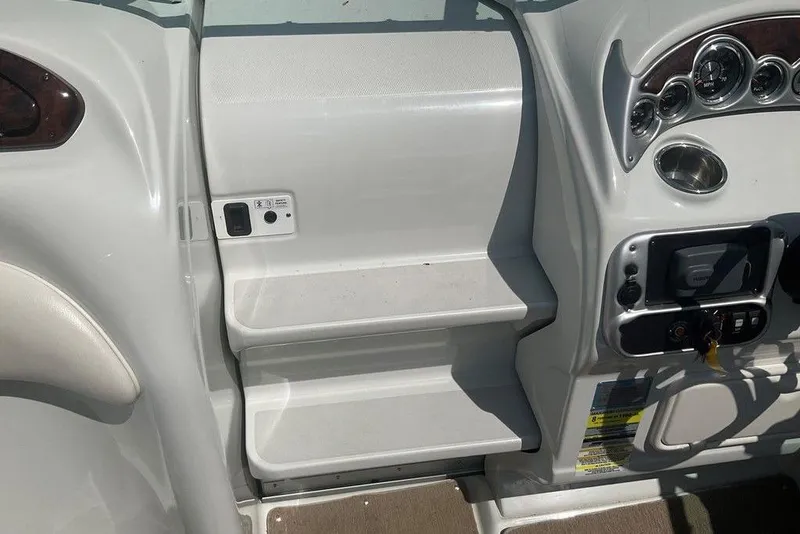 Slide: The Image of 2015 Crownline 236 SC boat dashboard with controls and gauges. - 14