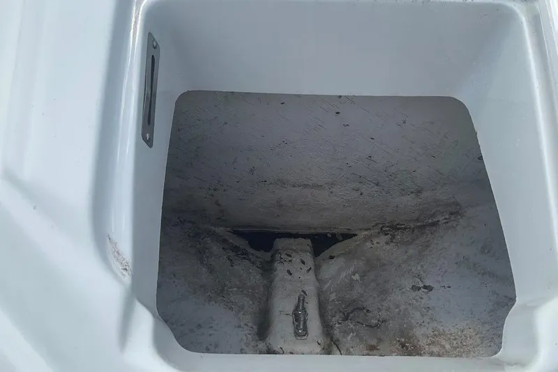 Slide: The Image of Storage compartment of a 2015 Crownline 236 SC boat, showing interior details. - 33