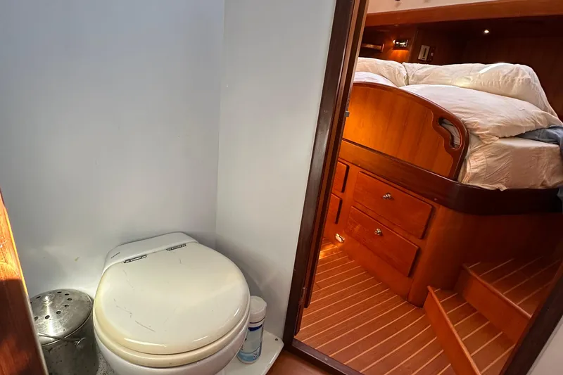 Slide: The Image of Compact bathroom and cozy bedroom on 2006 Passport 470 yacht. - 28