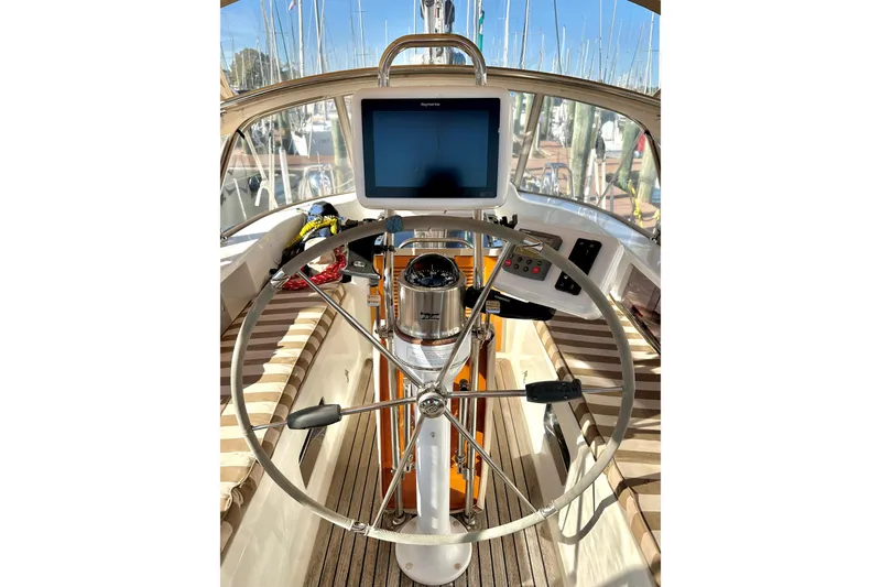 Slide: The Image of Steering wheel and navigation system on 2006 Passport 470 sailboat. - 45