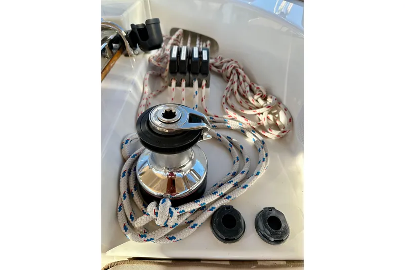 Slide: The Image of Sailboat winch with ropes on a 2006 Passport 470 yacht deck. - 47