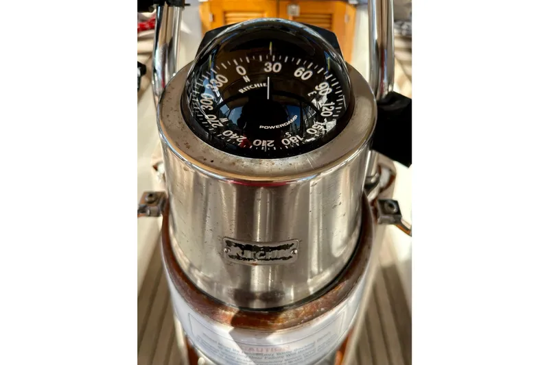 Slide: The Image of Stainless steel compass on a 2006 Passport 470 boat, featuring Ritchie navigation. - 50