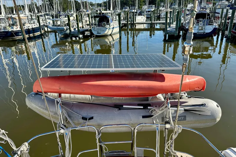 Slide: The Image of Docked boats with solar panel and kayak on Passport 470, 2006 model. - 54