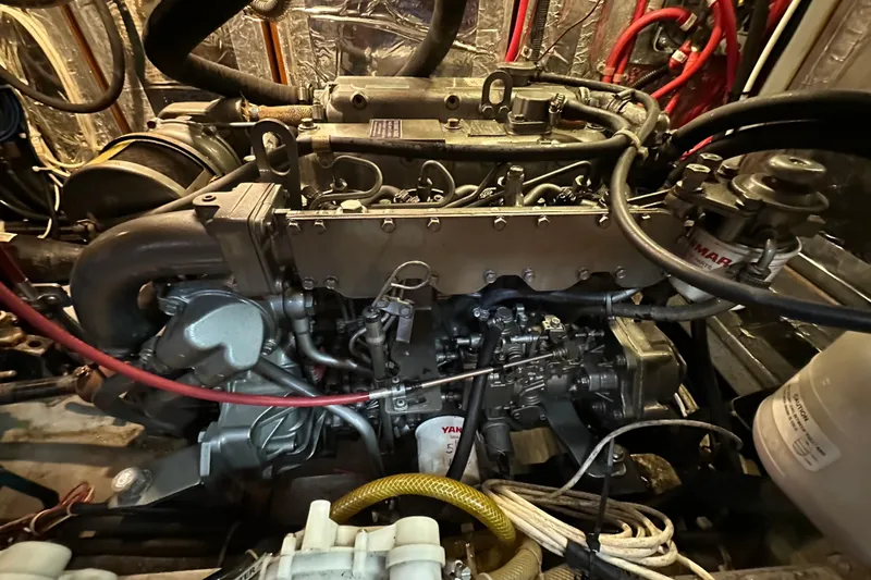 Slide: The Image of Engine compartment of a 2006 Passport 470, showcasing detailed mechanical components. - 56