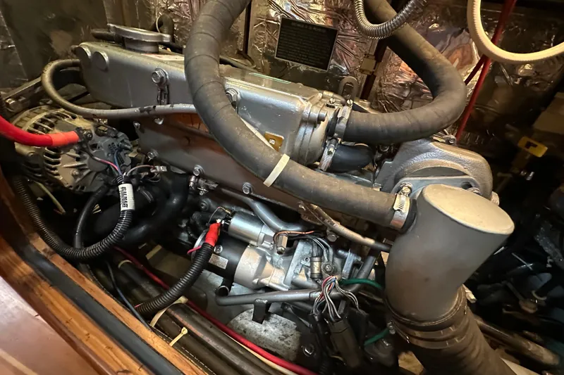 Slide: The Image of Engine compartment of a 2006 Passport 470, showcasing detailed mechanical components. - 57