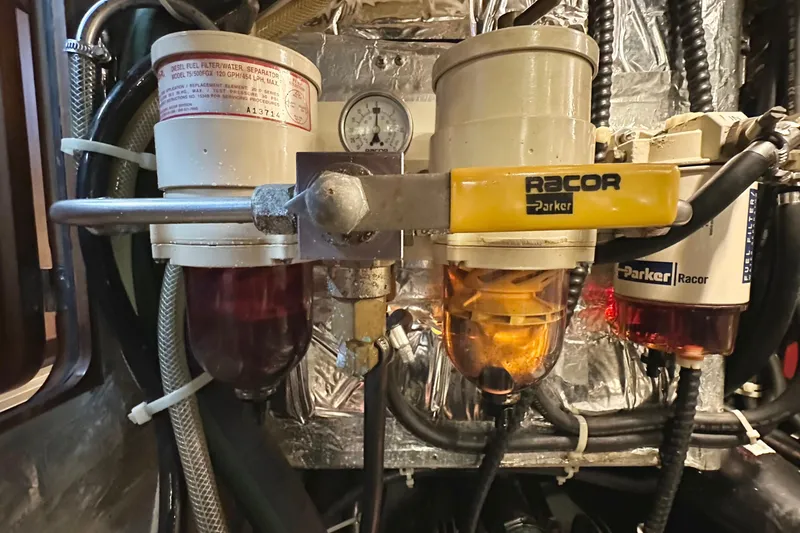 Slide: The Image of Diesel fuel filter system in 2006 Passport 470 engine room, featuring Racor Parker components. - 58