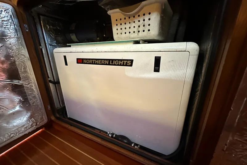 Slide: The Image of Northern Lights generator in a 2006 Passport 470 yacht engine room. - 59