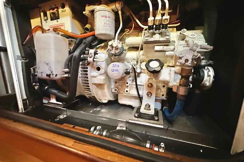 Slide: The Image of Engine compartment of a 2006 Passport 470, showcasing mechanical components and fuel system. - 60