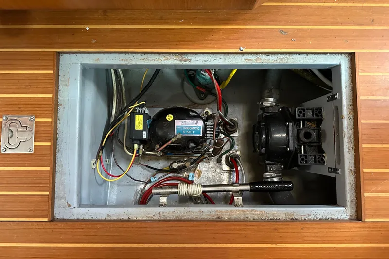 Slide: The Image of Boat engine compartment with wiring and components, Passport 470, 2006 model. - 65