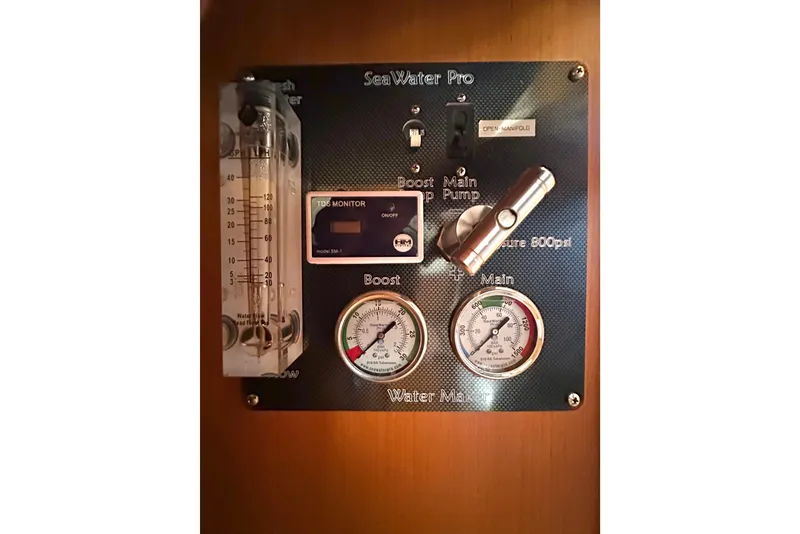 Slide: The Image of Control panel of a 2006 Passport 470 SeaWater Pro system with gauges and switches. - 66