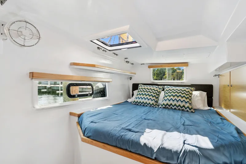 Slide: The Image of Cozy cabin interior of 2024 St Francis 460 yacht with bed and windows. - 104