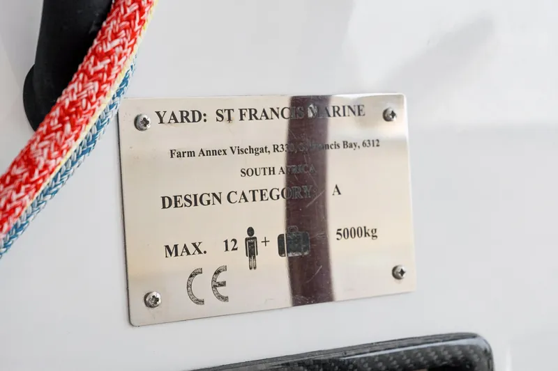 Slide: The Image of Plaque on St Francis 460, 2024 model, indicating design category A, max 12 people, 5000kg. - 109