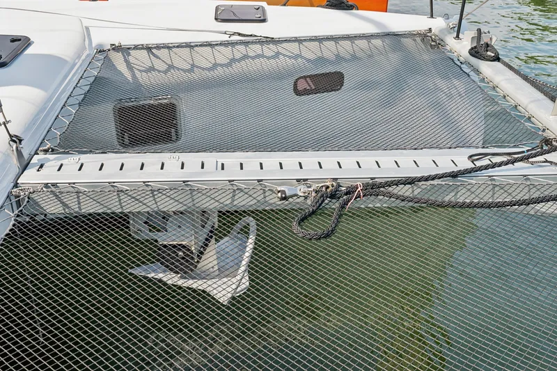 Slide: The Image of 2024 St Francis 460 catamaran deck with netting and anchor detail. - 121