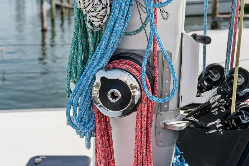 Slide: The Image of Colorful ropes on a St Francis 460 sailboat mast, 2024 model, docked at marina. - 128