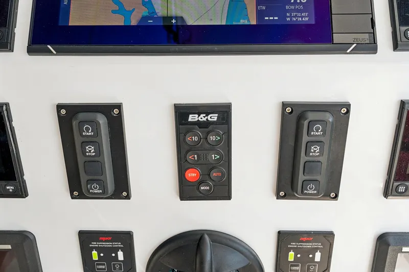 Slide: The Image of Control panel of 2024 St Francis 460 yacht with navigation and power buttons. - 135
