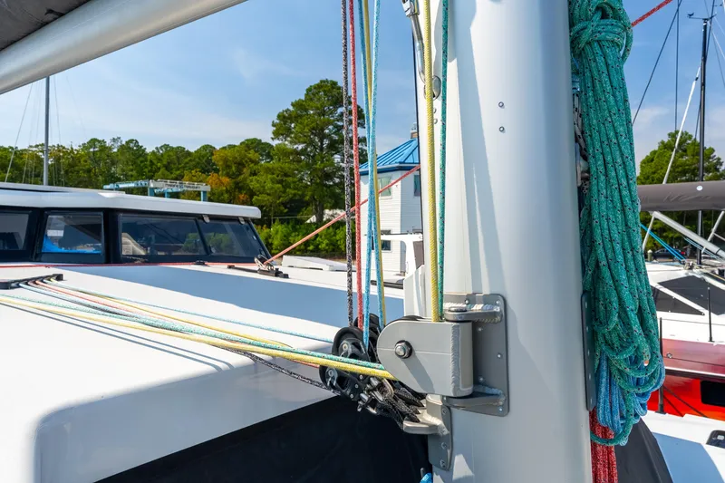 Slide: The Image of Sailboat rigging on a 2024 St Francis 460, featuring colorful ropes and mast details. - 14